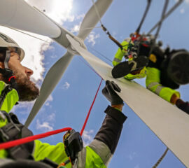 GWO Training at South West Maritime Academy. View from under on two rope access technicians working on blade of wind turbine high up.