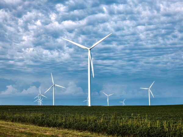 Wind farms filled with giant wind turbines have become a familiar site on actual American prairie farms, Iowa. Original image from Carol M. Highsmith's America, Library of Congress collection. Digitally enhanced by rawpixel.